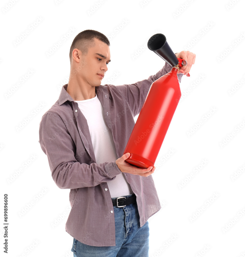 Teenage boy with fire extinguisher on white background