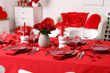 Sticker - Festive table setting decorated for Valentine's Day with red roses and candles at home