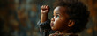 A young African American child with a raised fist, symbolizing empowerment and diversity, ideal for Black History Month.