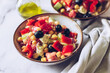 Healthy rich protein Greek salad with tomatoes, bell pepper, cucumber, black olives, feta cheese, onion and chickpeas