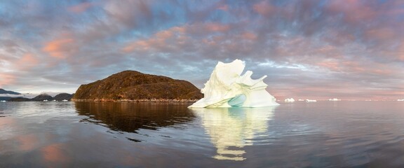 Wall Mural - Melting icebergs by the coast of Greenland, on a beautiful summer day - Melting of a iceberg and pouring water into the sea. Global warming
Arctic nature landscape, Summer day