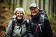 © toonsteb - old couple hiking in the forest bokeh style background