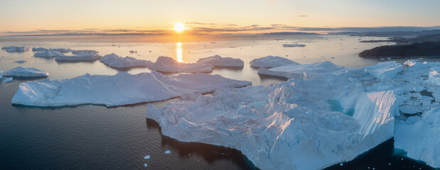 Wall Mural - Melting icebergs by the coast of Greenland, on a beautiful summer day - Melting of a iceberg and pouring water into the sea. Global warming
Arctic nature landscape, Summer day