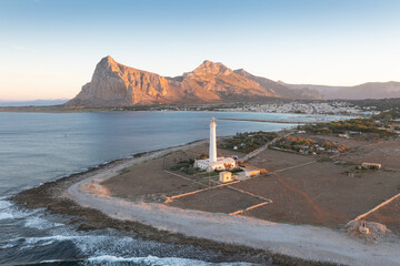 Wall Mural - San Vito Lo Capo Lighthouse is an active lighthouse located on the west coast of Sicily near Trapani. Italy.
A beautiful sunny day by the seashore. An active holiday.