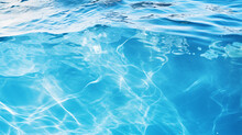 Clear Blue Water Surface With Splashing Ripples.
