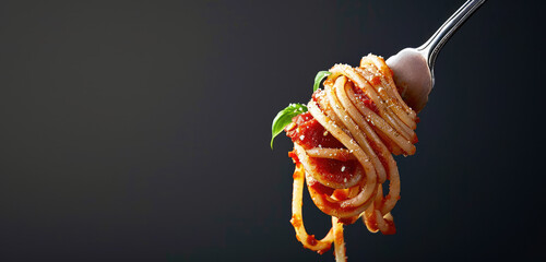 Italian Pasta with tomato sauce on a metal fork, copy space for text. Promotional banner for Italian week in a restaurant.