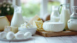 An assortment of Dairy products on a light colored kitchen. Creative banner for store of healthy farm dairy products. Milk, cottage cheese natural farm, copy space.