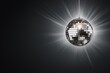 Disco ball glowing on neutral background