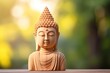 Hand carved sandstone Buddha statue crafted by devoted artisan symbolizing strong faith in Buddhism with gentle backlit ambiance