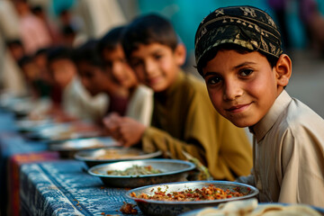 Children in the act of giving to charity, a key tradition of Eid