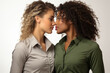 © sofiko14 - Portrait of two beautiful multinational lesbian women in casual shirts on a white background
