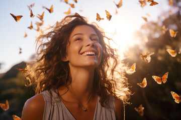 Happy brunette woman excited looking up in the butterflies
