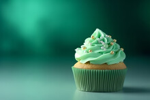 Delicious Decorated Cupcake With Leaf Clover Shamrock Toppings On Lush Green Background, Space For Text. St. Patrick's Day Celebration