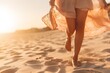 Close-up of female legs walking barefoot in the sand on the beach, transparent sensual dress, blur background, golden hour. Romantic atmosphere