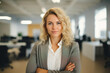 © Andrii  - Approachable Young Professional with Crossed Arms
