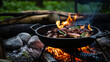 A rustic outdoor cooking setup with a cast iron pot over a campfire.