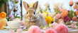 a rabbit wearing a bow tie sits on a table with flowers