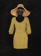 Poster - yellow short dress on a mannequin