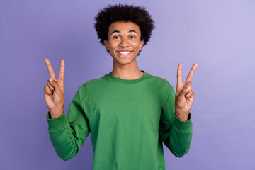 Canvas Print - Photo of cool positive guy wear green pullover showing two v-signs isolated purple color background