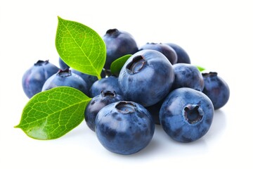 Wall Mural - Fresh blueberries with vibrant green leaves on a white background.