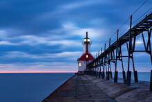 Lighthouse On The Pier At Sunset