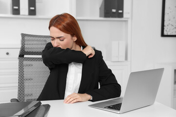 Poster - Woman coughing at table in office. Cold symptoms