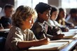 © Elena - little kids studying in a classroom writing sitting at desk