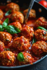 Wall Mural - A pan filled with meatballs covered in delicious sauce. Perfect for a hearty meal or Italian cuisine