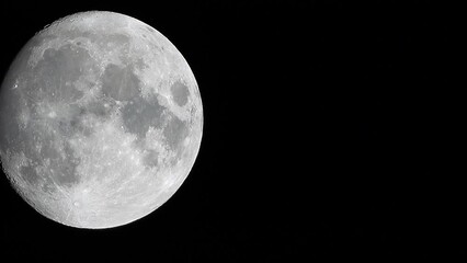 Wall Mural - A glowing huge full moon seen from earth through the atmosphere against a starry night sky. A large full moon moves across the sky, the moon moving from the bottom left frame to the top right.