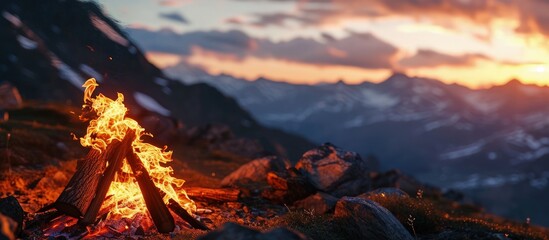 Sticker - Bonfire on a background of the sky in the mountains. Creative Banner. Copyspace image