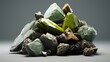 A pile of green stones on a grey background. Rocks piled up