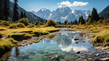 Fototapeta Sypialnia - A tranquil mountain river flowing through a scenic alpine valley with snow-capped peaks and a clear blue sky in the background.