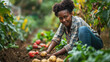 Portrait of the smiling happy young woman horticulturist eco farm worker on fertile soil with harvest organic potatoes. Concept of ecological environment