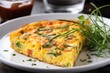close up piece of frittata with vegetables and herbs on a white plate.omelet.breakfast