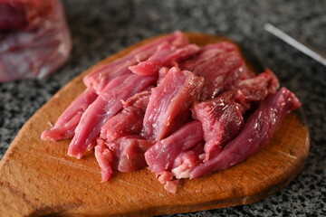 Wall Mural - sliced veal strips, beef goulash, red beef meat sliced for cooking