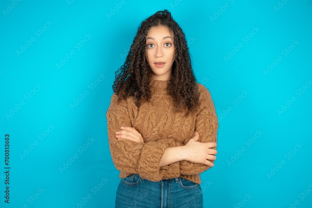 Shocked embarrassed Beautiful teen girl wearing knitted sweater over ...