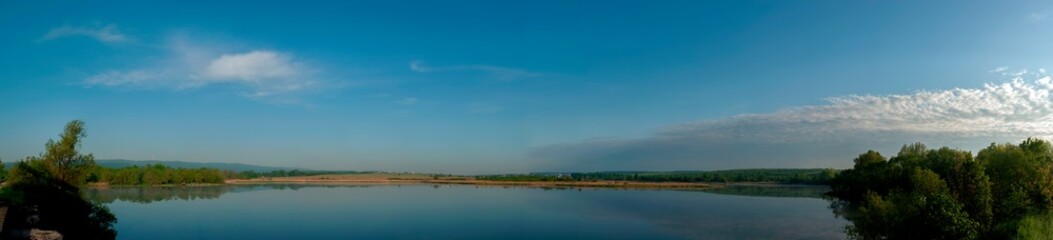 Wall Mural - Panorama lake view in sunrise time .Sunrise at the lake