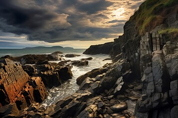 Wall Mural - rocky shoreline meeting the sea with dramatic clouds overhead