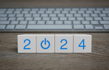 2024 start up business icon on white block cubes on wooden table with modern computer keyboard, happ