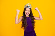 Excited face, cheerful emotions of teenager girl. Portrait of ambitious teenage girl with crown, feeling princess, confidence. Child princess crown on isolated studio background.