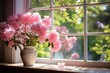 Pink peonies in a classic jug on a sunny windowsill