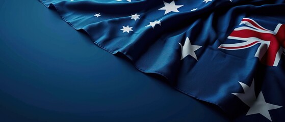  a close up of an australian flag on a blue background with a white star design on the left side of the flag.