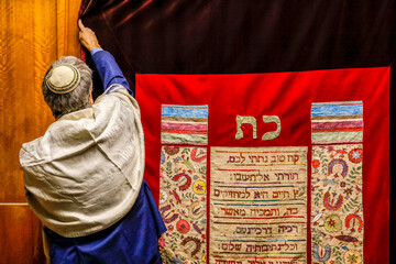 Wall Mural - Rabbi closing a synagogue sacred ark curtain, Paris, France