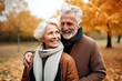 © Muh - Affectionate senior couple in autumn park, space for text