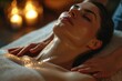 A woman receiving a massage at a spa. Perfect for promoting relaxation and self-care