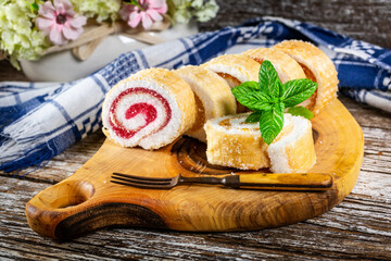 Wall Mural - Slices of homemade sweet roll with fruit jam.