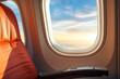 © artsterdam - Comfortable airplane seats and a view of the blue sky and clouds