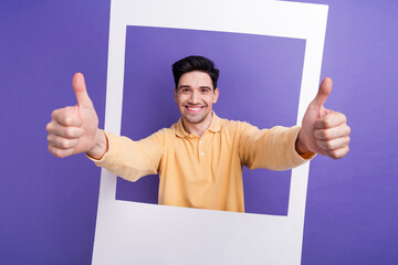 Sticker - Photo portrait of attractive young man show thumb up instant photo frame dressed stylish yellow clothes isolated on purple color background