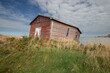 Abandon red fishing shack in Newfoundland, Canada