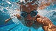 A swimmer wearing goggles swimming in a pool.